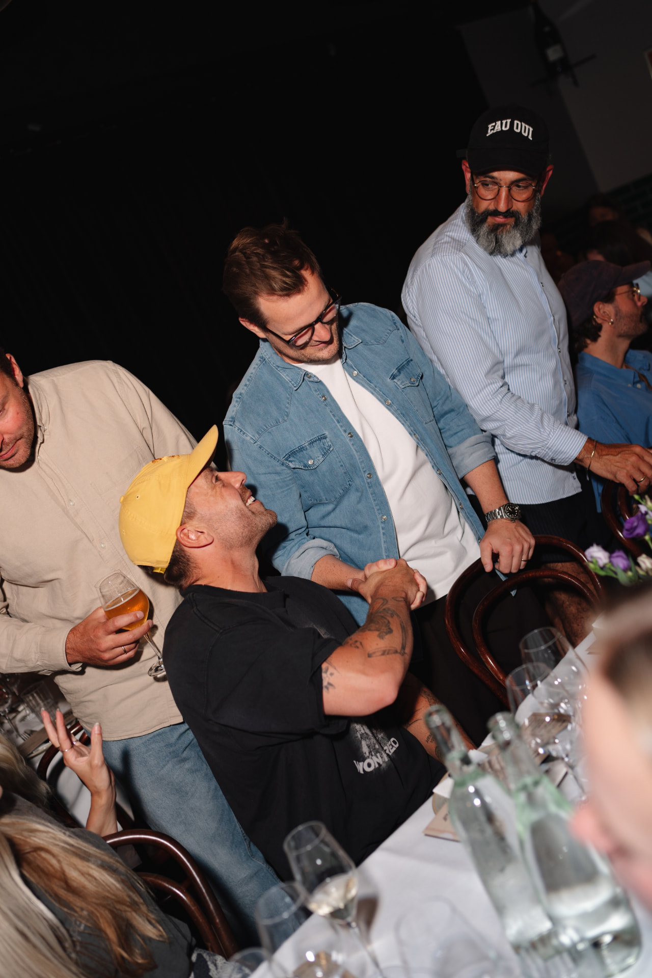 Two guests shaking hands at an Ask Phill network dinner